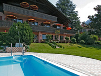 Let yourself be enchanted by our garden with pool